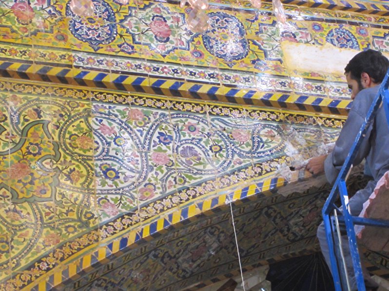 Applying tile-work in the middle ring of the shrine of Imamain Al-Javadain(peace be upon them)