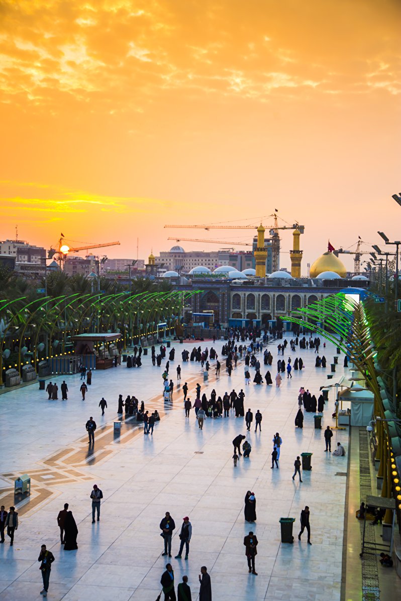 A view of the dome and minarets of Imam Hussein Shrine at sunset