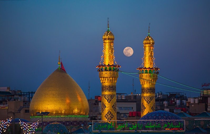 A beautiful view of the moon between two minarets of the shrine of Hazrat Abbas